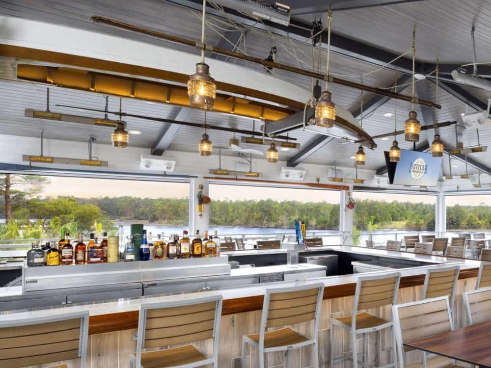 Ceiling suspended Solaira CosyXL H2 Stainless Steel heaters over the open bar and outdoor seating for the Overlook Bar Restaurant in Latitude Margaritaville FL