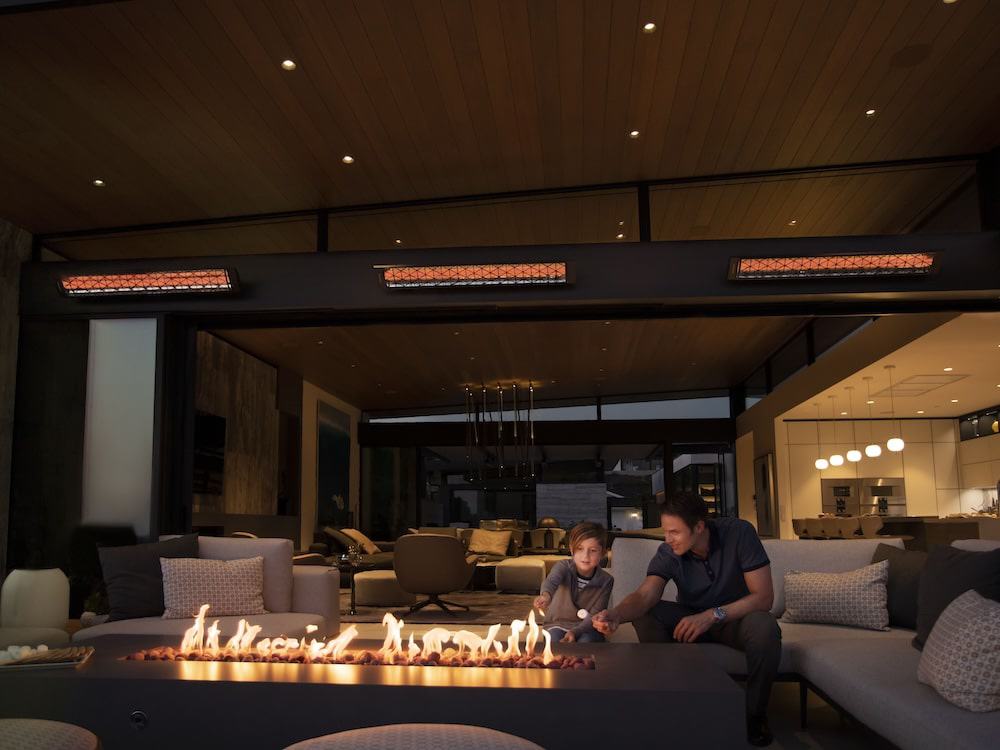 Infratech CD Series Heaters wall-mounted in a residential indoor/outdoor patio
