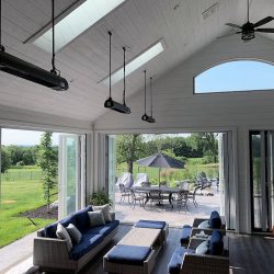 Ceiling Suspended Mounted AURA heaters in a spacious white enclosed residential porch in CA