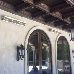 Beverley Hills private residence with Solaira Alpha H3 custom painted and installed on stucco wall above arched windows.