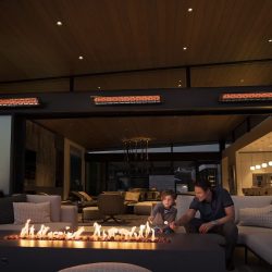Infratech CD Series Heaters wall-mounted in a residential indoor/outdoor patio
