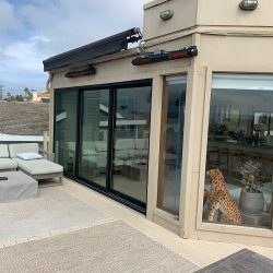 Solaira CosyXL H2 heater wall mounted on residential deck in La Jolla CA.
