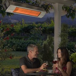 Sunpak overhead patio heater providing warmth for a couple sitting on their patio